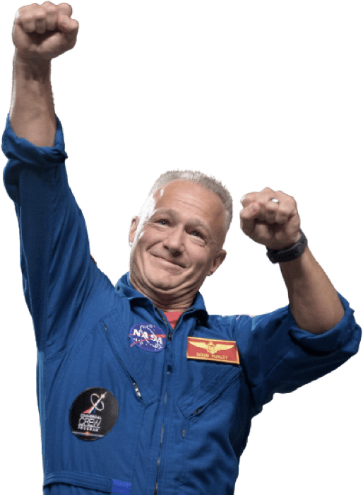 Douglas Hurley in a space suit, excitedly fist pumping